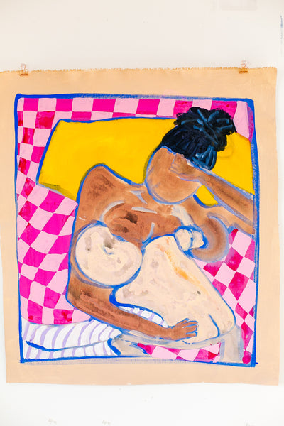 Woman nursing baby in bed